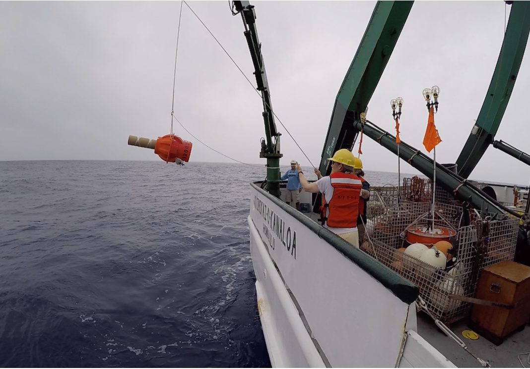 A Deep SOLO ocean float being lowered into the sea from a research ship